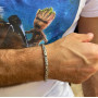 Silver chain on hand for a man