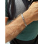 Silver chain on hand for a man