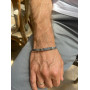 Silver chain on hand for a man