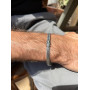 Silver chain on hand for a man